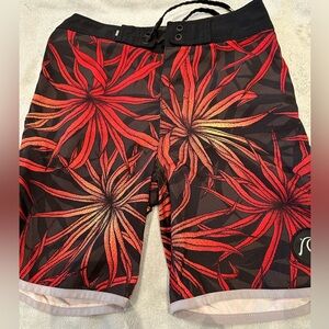 QUIKSILVER Boys Size 23 Black with Orange Starburst Flowers Swim Trunks